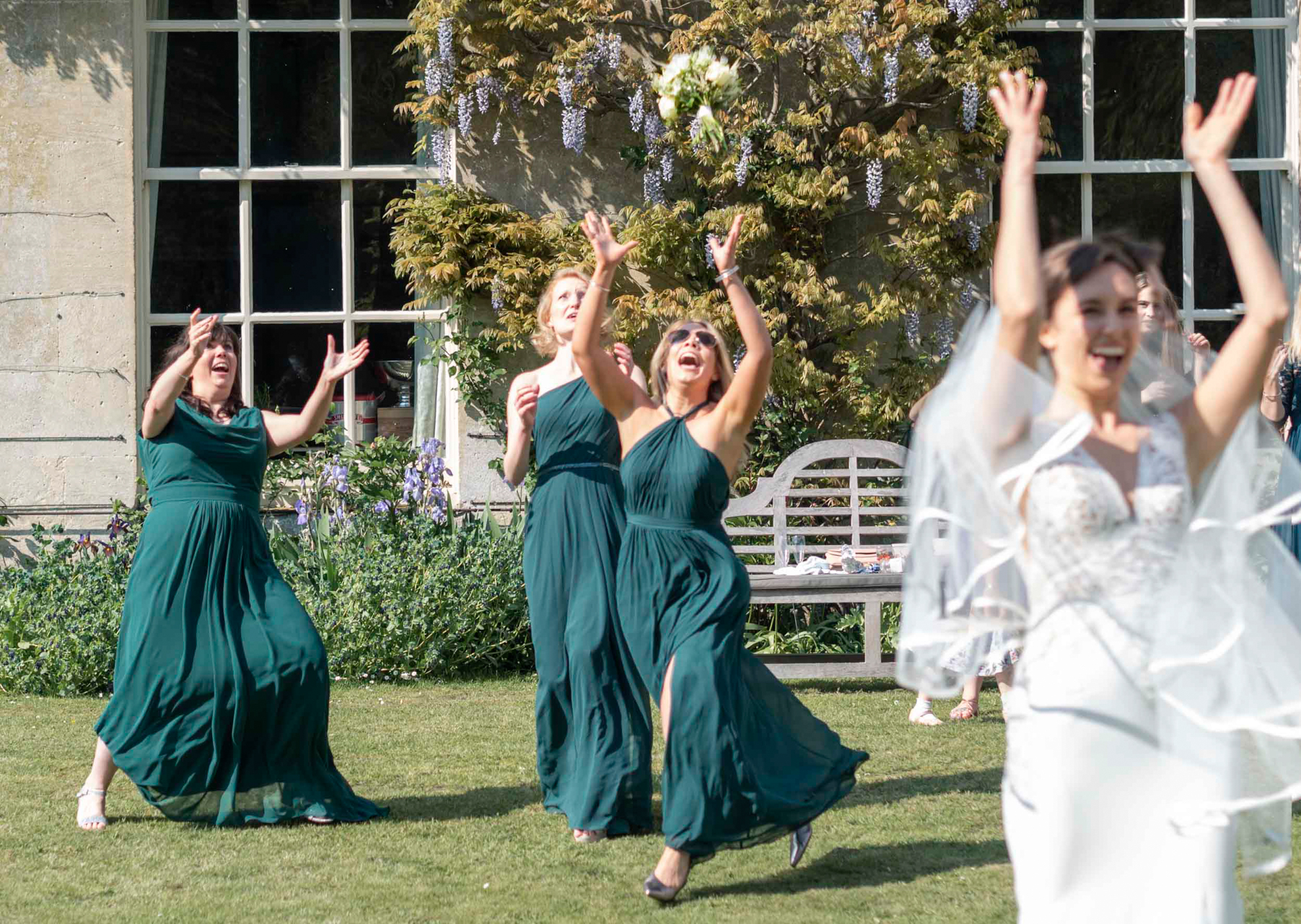 Ana tosses the bridal bouquet.